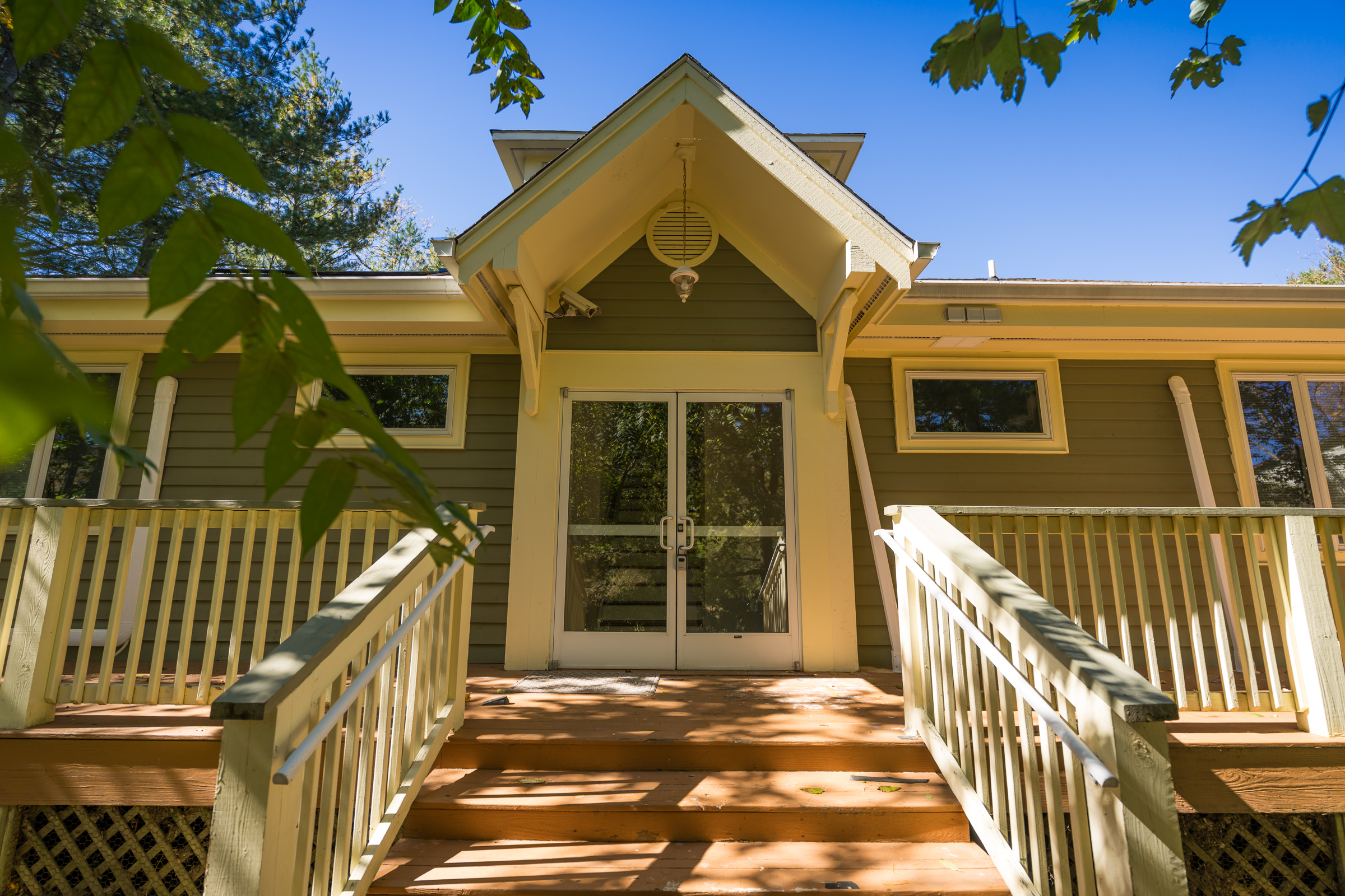 Building back entrance with deck stairs