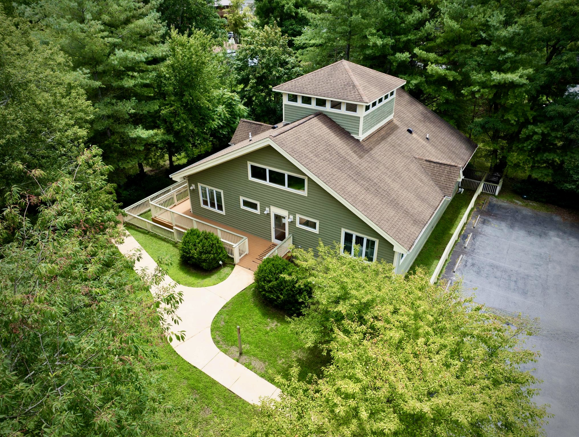 Aerial side view of building with parking
