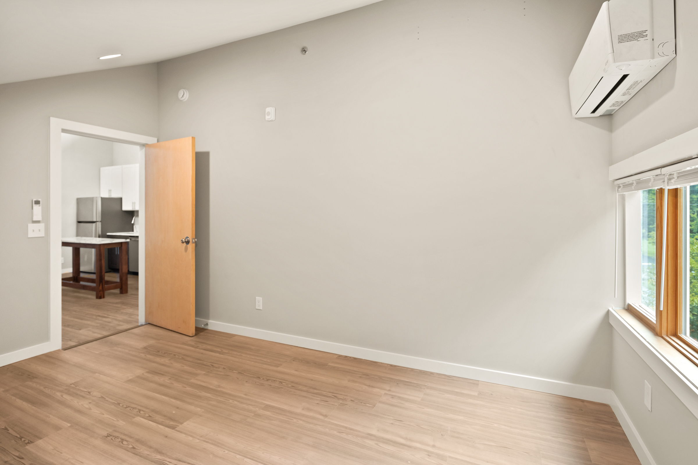 Unit 201 - Bedroom with vaulted ceiling